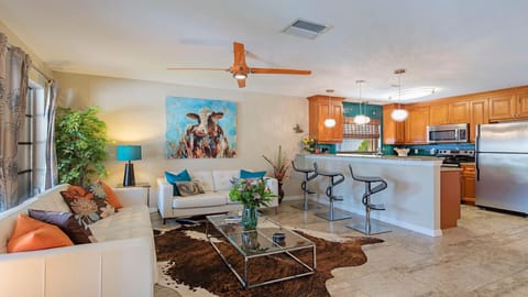 Open Concept Living-room with lots of natural light and a ceiling fan