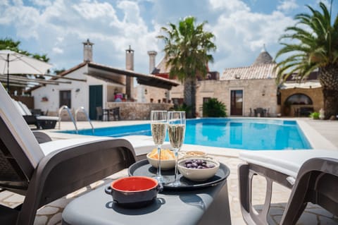15 outdoor pools, open 8:00 AM to 8:00 PM, pool umbrellas, sun loungers
