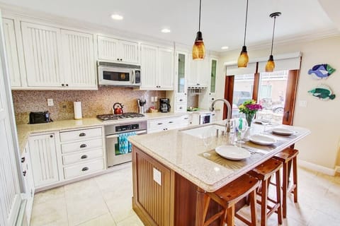 Dishwasher, large refrigerator and 12 cup coffee maker, cookware and dinnerware!