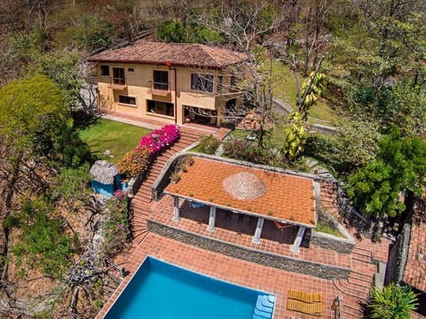 Spacious, & secluded property with house, comfortable shaded pool deck and pool.