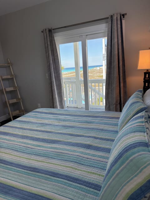King Bedroom on Main level-Gulf Views. Great views of gulf and access to deck.