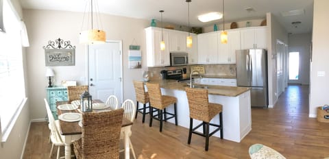 The open floorplan is bright and inviting with views straight through to pool.