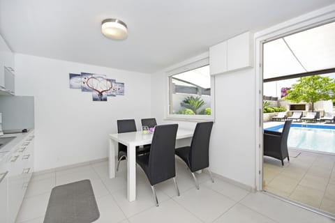 Fully equipped summer kitchen with a toilet, next to the pool
