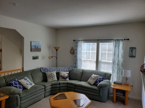 Main living room area with access to outside deck