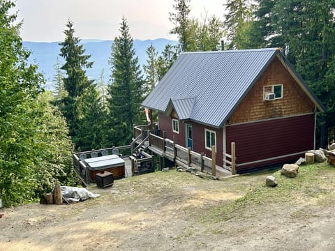 Cozy cabin retreat with private hot tub and forest views