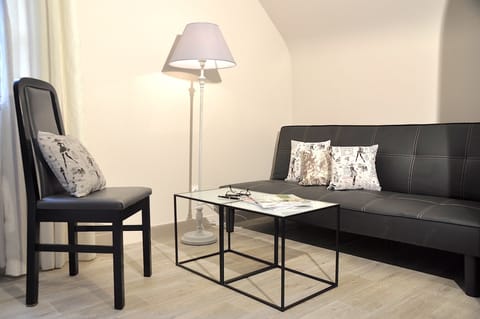 Family Suite | Living area | Flat-screen TV