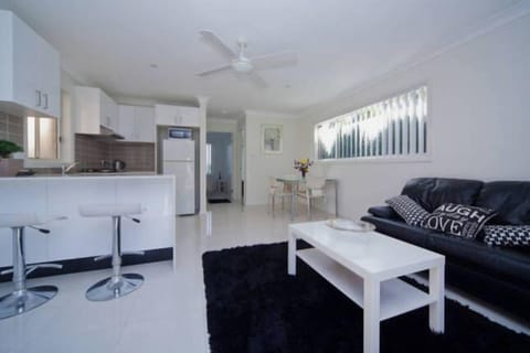 Spacious lounge and dining area with full kitchen.  Aircon and ceiling fans
