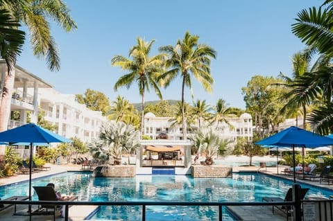 Take a moment to relax by the pool, appreciating the beauty of nature around you.