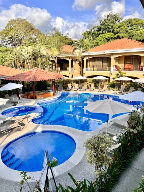 Pool area with pool for adults, kids and one jacuzzi.