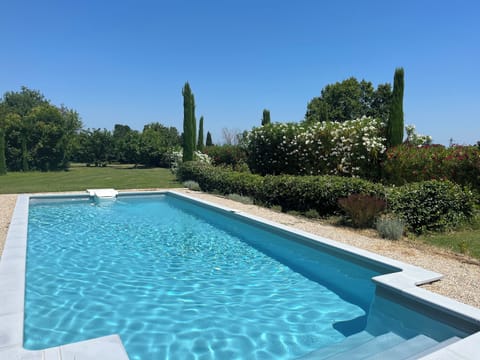 La Maison Blanche pool and garden .