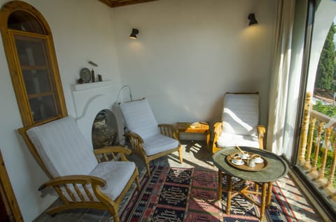 Master bedroom private sitting room with garden view