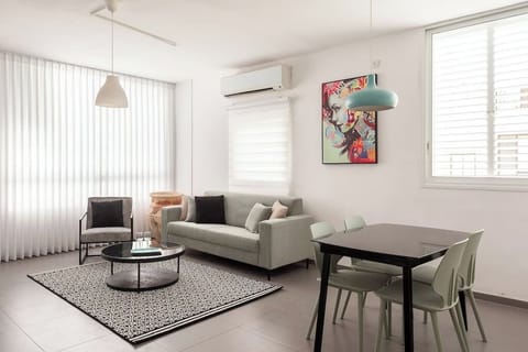 Bright living area with calming atmosphere, perfect for relaxing after short walks returning from nearby beach.