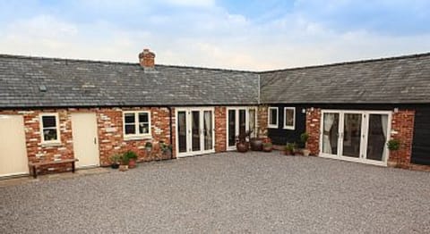 Courtyard showing Txoko Cottage (left) and Little Owls Cottage (right)