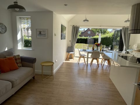 Open plan kitchen dinging with seating area