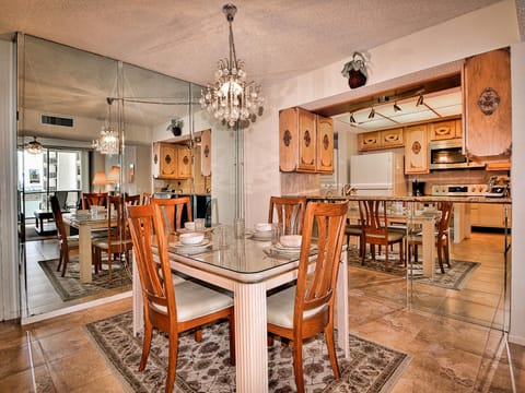 Dining table has seating for 4 guests.