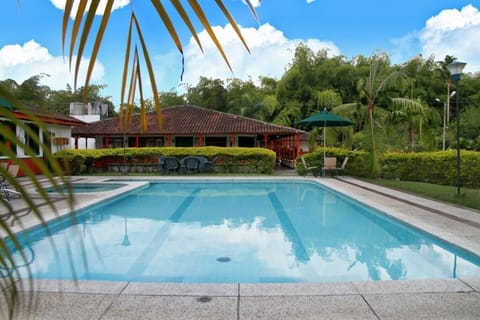 Outdoor pool, pool umbrellas, sun loungers