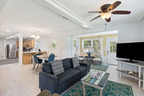 The home offers plenty of space, with each floor featuring a living room, dining room and kitchen. (Lower floor pictured here.)