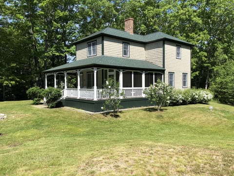 Side of the house with the screened in porch.