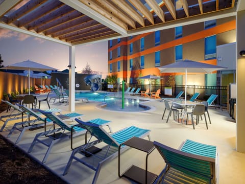 Seasonal outdoor pool, open 11:00 AM to 8:00 PM, pool umbrellas