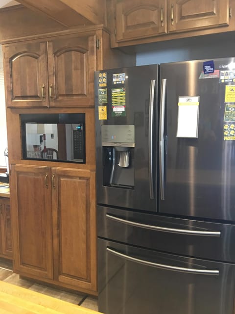 Kitchen: Stainless steel refrigerator with water and ice through the door