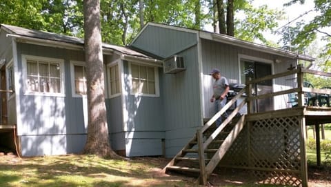 Rustic cabin with a view of lake from three sides of the house.