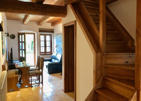 Fully renovated living room with direct access to porch and property yard.