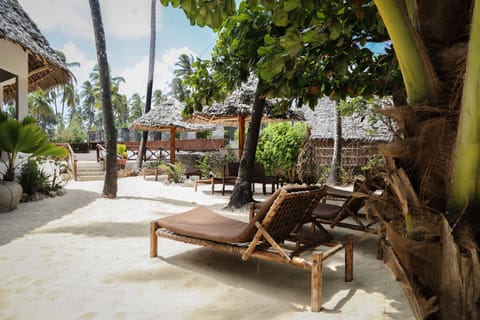 Private beach, white sand, sun loungers, beach umbrellas