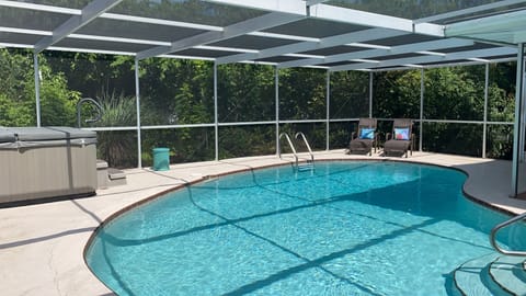 Relax in our lovely lanai and enjoy our heated pool amongst our fruit trees !