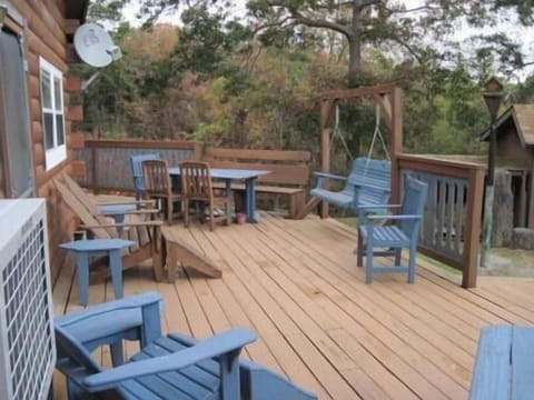Front Deck with Outdoor Table, Adirondack Chairs, and Swinging Bench
