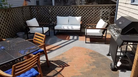 Outdoor space with seating and gas grill