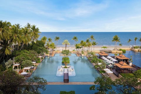 Main swimming pool, lounge areas, and beach