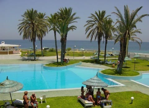 Seasonal outdoor pool, open 9 AM to 6 PM, pool umbrellas, sun loungers