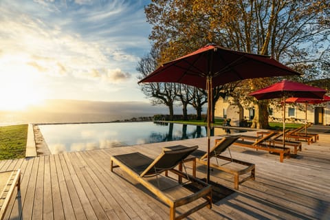 Indoor pool, outdoor pool, open 9:00 AM to midnight, pool umbrellas