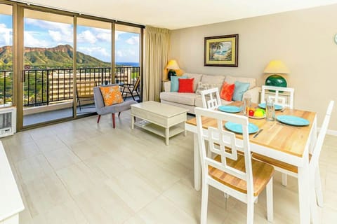 Bright living and dining area with mountain views from the balcony