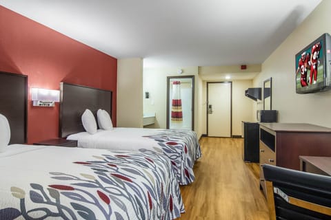 Desk, laptop workspace, blackout drapes, free cribs/infant beds