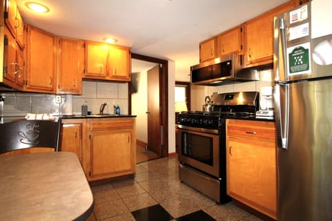 Modern eat-in kitchen with granite flooring and countertops.