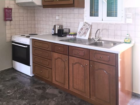 Apartment, 1 Bedroom, Sea View (03) | Private kitchen | Full-size fridge, oven, stovetop, coffee/tea maker