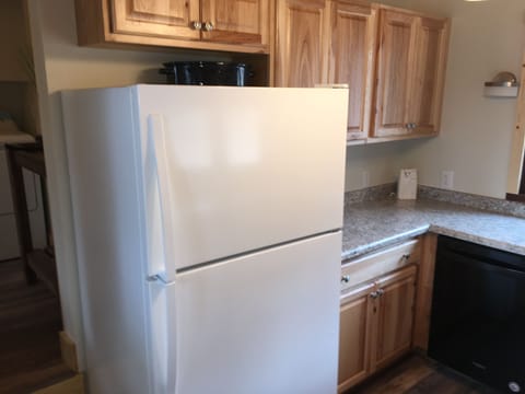 Kitchen w/ microwave, stove, refrigerator, dishes, pots pans, crock pot, etc...