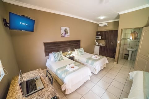 Family Room, Multiple Beds, Non Smoking, Garden View | In-room safe, desk, laptop workspace, iron/ironing board (on request)