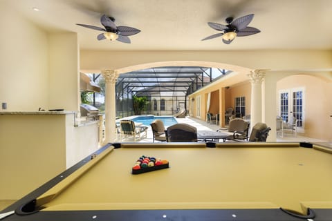 Play a game of pool under the covered cabana. 
NOTE: slide in background removed