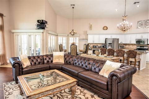 Decadent leather tufted sectional with plenty of seating for the whole family!