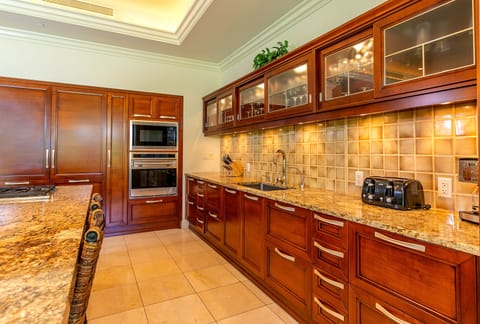 Kitchen features a double oven and granite counters