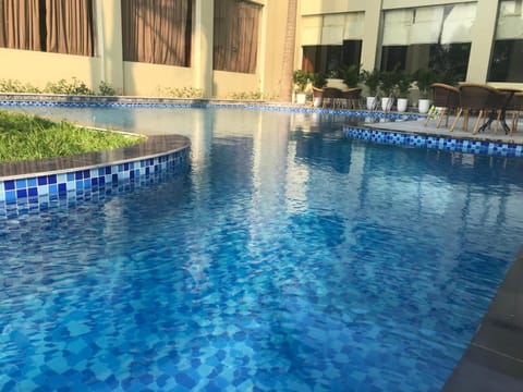 Outdoor pool, open 8:00 AM to 9:00 PM, pool umbrellas, sun loungers