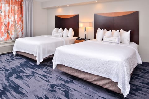 Pillowtop beds, desk, blackout drapes, iron/ironing board