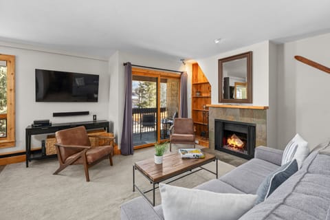 Living Room with Fireplace and Balcony