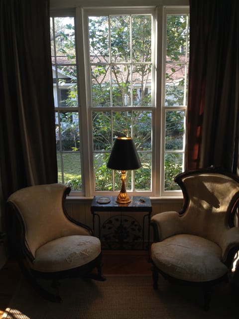 Sitting rm of master suite. It leads into master half bath.