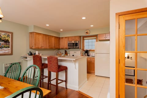 The updated kitchen has everything a chef would need. Have a seat and watch!