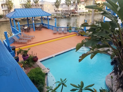 Beautiful view from balcony overlooking the pool and has a view of the canal.