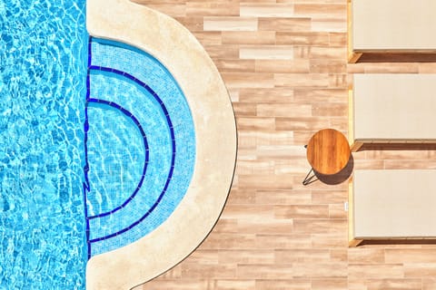 Outdoor pool, open 10:00 AM to 6:00 PM, pool umbrellas, sun loungers