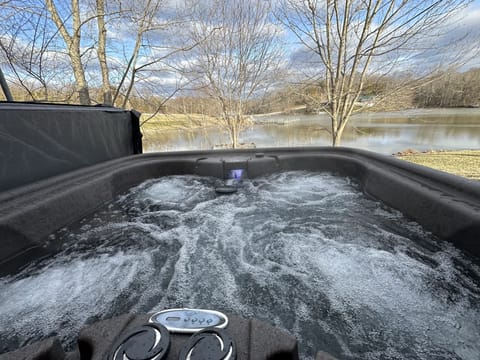 Enjoy the year round hot tub while taking in the serenity of the lake.